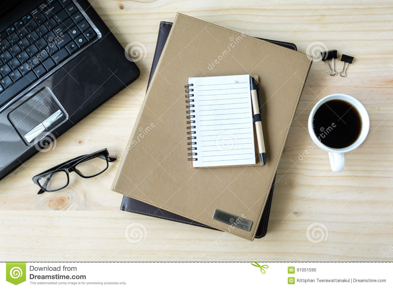stack-folder-coffee-laptop-wooden-desk-top-view-61051590.jpg